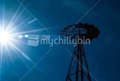 Static windmill in hot summer sun