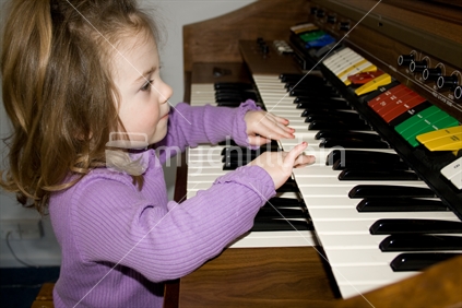 Little girl making music