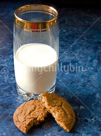 Broken biscuit with milk