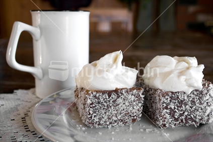 Creamed chocolate lamingtons with drink