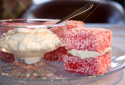 Lamingtons with a bowl of cream