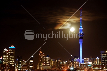 Auckland City at night with a full moon