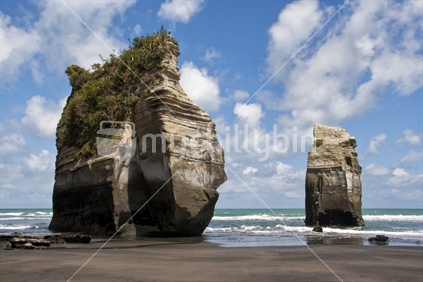 Three sisters rock formation at Tongaporutu Taranaki, New Zealand. (Note: there are 2 sisters now as 1 has eroded).


