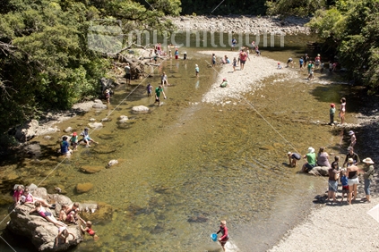 Children play in the Pakuratahi River near its junction with the Hutt River at Kaitoke