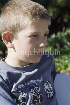 Eleven year old caucasian boy in deep thought