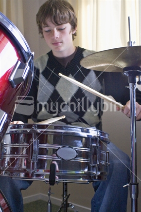 Teenager playing his drums