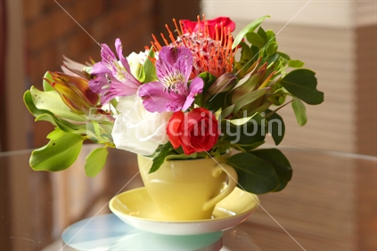 Bouquet of flowers in a cup  

