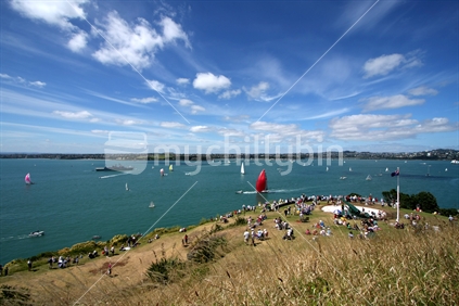 People watching sail boat race in Auckland 