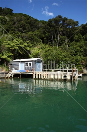 Jetty and boat house in the Malborough Sounds, South Island, New Zealand