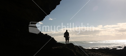Silhouette of a man at Bethells Beach, Auckland west coast 