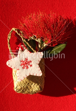 flax bag with a Pohutukawa blossom  and christmas star
