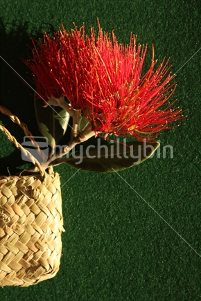 flax bag with a Pohutukawa blossom 