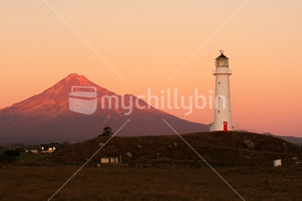 Cape Egmont Lighthouse at sunset, Taranaki, New Zealand
