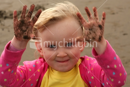 Girl playing in the sand
