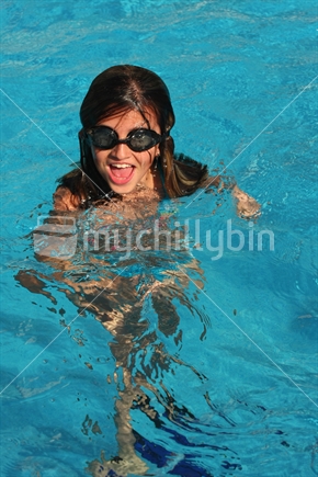 Girl playing in a pool
