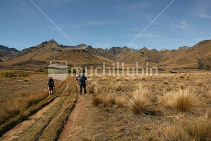 two walkers on a high country track near Queenstown, South Island
