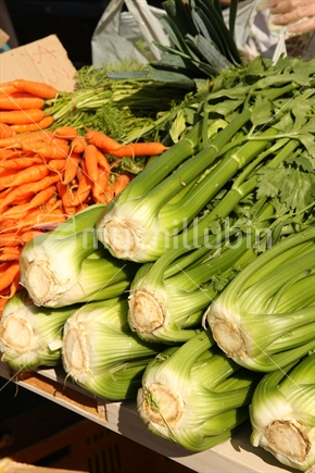 Organic celery and carrots on a stall at a New Zealand farmers market.
