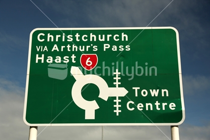 Road sign in Greymouth showing routes to Town Centre, Christchurch via Arthur's Pass, Haast, in the South Island
