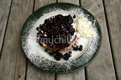 Cafe, serving New Zealand blueberries, with pancakes, with freshly whipped cream on outdoor tables. No 1. 