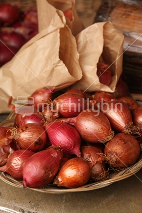 Organic red onions on display at a farmers market in New Zealand.