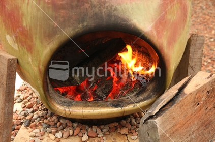Outdoor fireplace,  in a New Zealand backyard.