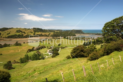 Farmland in front of the Puhoi River and Wenderholm reserve and beach, Auckland, New Zealand.