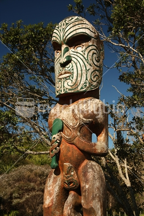 Maori carving, Omaha Beach, Rodney District, North Island, New Zealand.