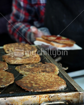 Whitebait fritters being served. 