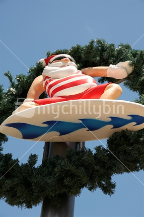 Santa Claus on a surfboard, Takapuna, December 2011.
