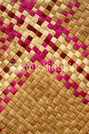 Closeup of a kete with pink pattern