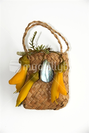 Kowhai flowers, in a kete.