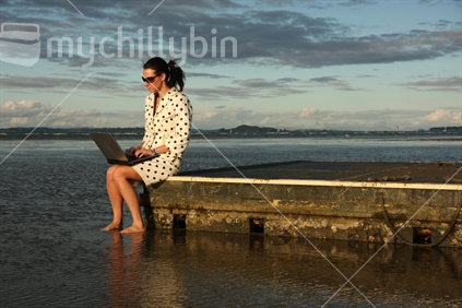 Well dressed woman with a laptop, Cheltenham Beach, Devonport, Auckland