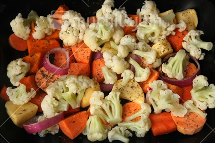 Vegetable roast with cauliflower, kumara, obions and carrots, seasoned and ready to cook