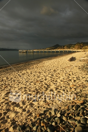 Beautiful light on Omapere beach with the old jetty in the background, Northland