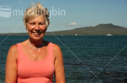 Attractive woman with Rangitoto Island in the background, Takapuna, North Shore, Auckland