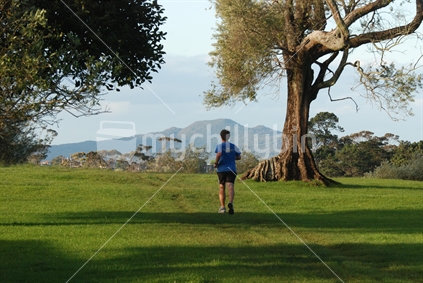 Runner, Rangitoto Island in the background