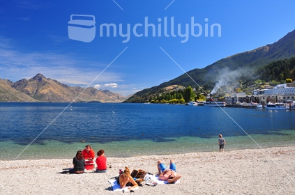 People chillin' out on the lake front in Queenstown