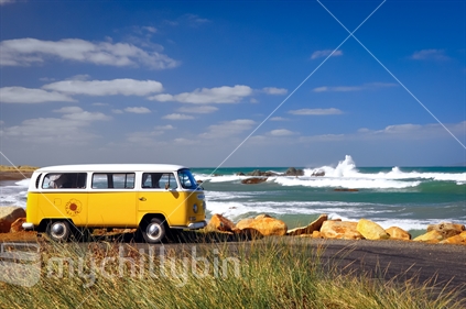 Yellow Volkswagen camper.  Parked at the beach in Southland