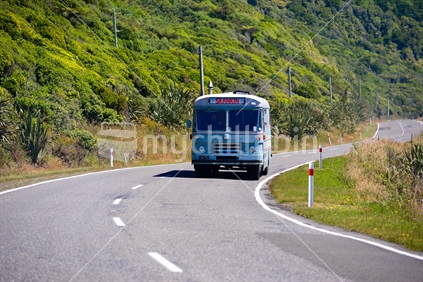 Old bus travelling along coastal westcoast road