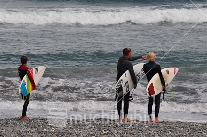 group of young surfers on westcoast beach