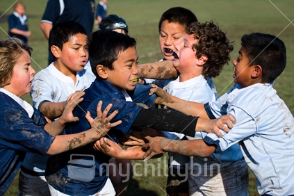 Young kids playing rugby