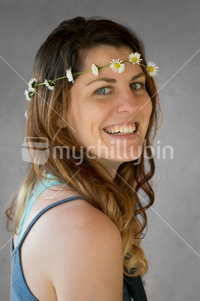 Young woman with daisy chain.