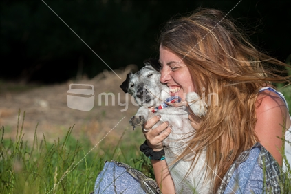 Young woman and her aged fox terrier dog 