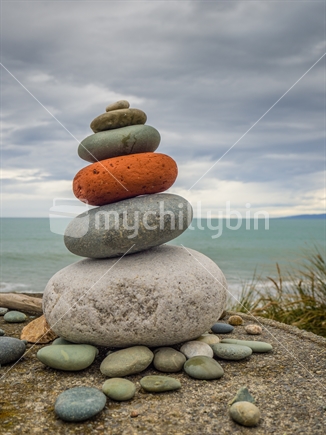Stones on concrete pillar at Gemstone Beach on stormy day