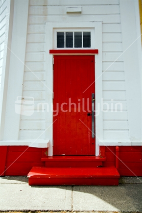 The red door of Akaroa's historical lighthouse
