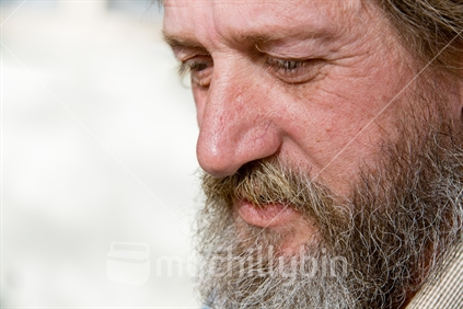 Close up of man's face with a sorrowful look