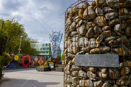 Spring (2014) in Cathedral Square, Christchurch. Cairn made of stones gathered from Canterbury rivers, placed by residents concerned that protection of the rivers has been broken.