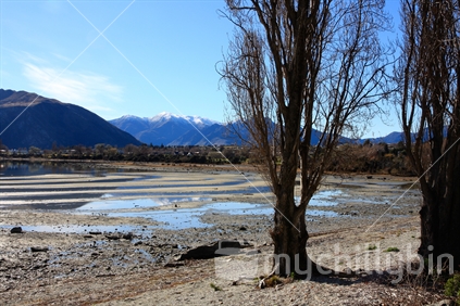 Very low water level in Lake Wanaka, South Island.
