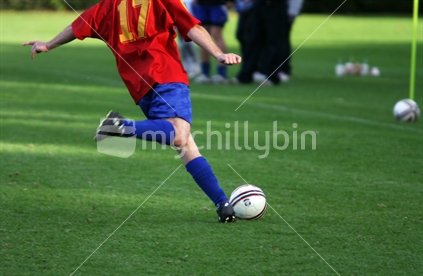 Soccer player about to kick ball