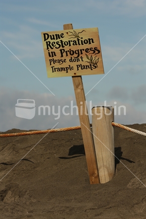 Dune Restoration sign at Piha Beach, New Zealand